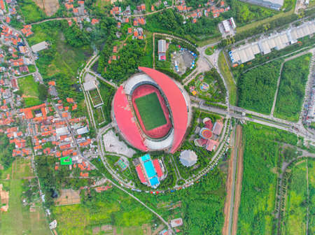 Aerial top down view of the Beautiful scenery of Wibawa Mukti Stadium when sunrise. with Bekasi...