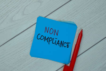 Impact write on sticky notes isolated on Wooden Table.の写真素材