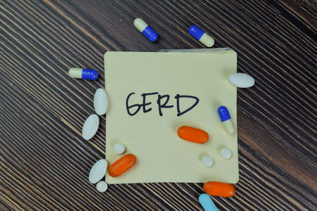 General Manager write on a paperwork isolated on Wooden Table.の写真素材