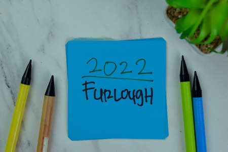 2022 New Personal Positioning write on sticky notes isolated on Wooden Table.