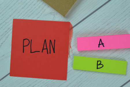 Concept of Are you Eligible? write on sticky notes isolated on Wooden Table.
