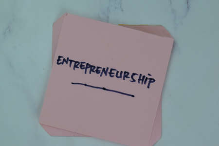 Concept of Small-Cap Stock write on a book isolated on Wooden Table.の写真素材