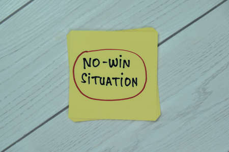 Concept of Insider Trading write on sticky notes with gavel isolated on Wooden Table.