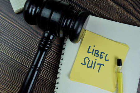 Concept of Off-Label write on sticky notes isolated on Wooden Table.の写真素材