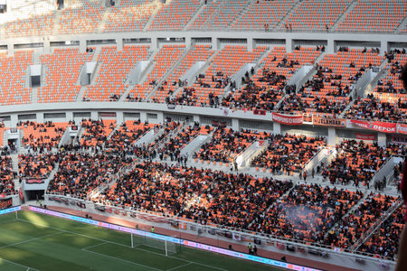 Crowds on Group of fans on the stadium Jakarta International Stadium. Jakarta, Indonesia, August 1, 2022のeditorial素材