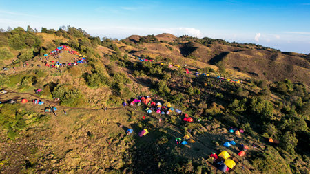 Aerial view of beauty mountain peaks Prau Dieng, Central Java and the climbers and tent. Wonosobo, Indonesia, September 30, 2022の写真素材