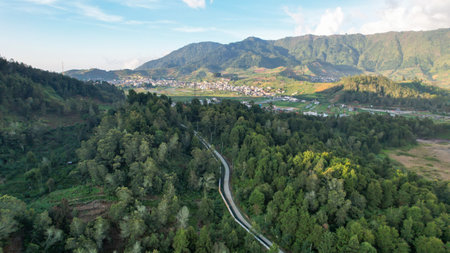 Aerial view of beauty mountain peaks Prau Dieng, Central Java and the climbers and tent. Wonosobo, Indonesia, September 30, 2022の写真素材
