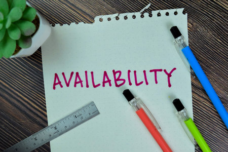 Concept of Availability write on sticky notes isolated on Wooden Table.の写真素材