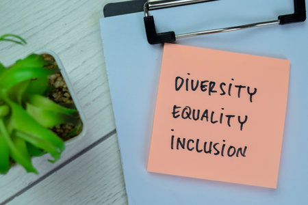 Concept of Diversity, Equality, Inclusion write on sticky notes isolated on Wooden Table.の写真素材