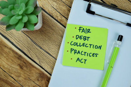Concept of Fair, Debt, Collection, Practices, Act write on sticky notes isolated on Wooden Table.