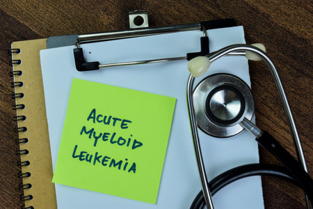 Concept of Acute Myeloid Leukemia write on sticky notes with stethoscope isolated on Wooden Table.