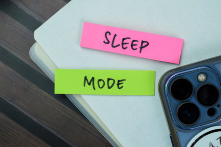 Concept of Sleep Mode write on sticky notes isolated on Wooden Table.