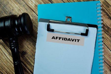 Concept of Affidavit write on paperwork isolated on Wooden Table.