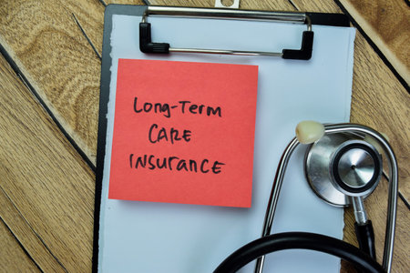 Concept of Long-term Care Insurance write on sticky notes isolated on Wooden Table.の写真素材