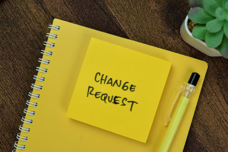 Concept of Change Request write on sticky notes isolated on Wooden Table.