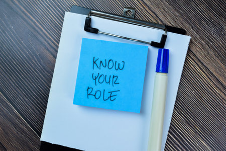 Concept of Know Your Role write on sticky notes isolated on Wooden Table.の写真素材