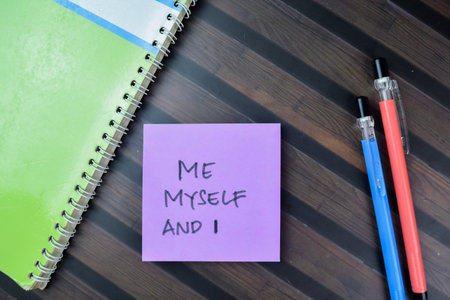 Concept of Me Myself And I write on sticky notes isolated on Wooden Table.の写真素材