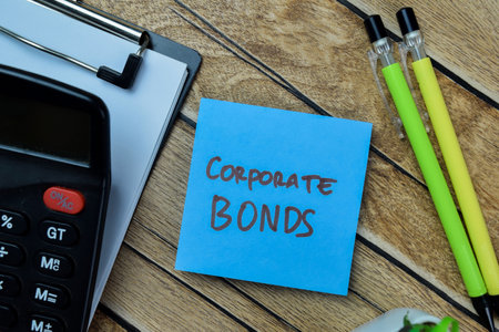 Concept of Corporate Bonds write on sticky notes isolated on Wooden Table.の写真素材