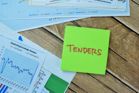 Concept of Tenders write on sticky notes isolated on Wooden Table.の写真素材