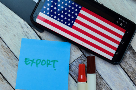 Concept of Export write on sticky notes with US flag isolated on Wooden Table.の写真素材