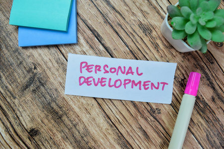 Concept of Personal Development write on sticky notes isolated on Wooden Table.の写真素材