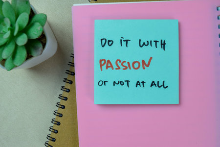 Concept of Do It With Passion or Not At All write on sticky notes isolated on Wooden Table.
