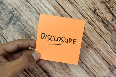 Concept of Disclosure write on sticky notes isolated on Wooden Table.の写真素材