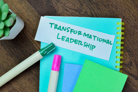 Concept of Transformational Leadership write on sticky notes isolated on Wooden Table.の写真素材