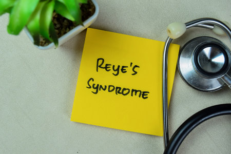 Concept of Reye's Syndrome write on sticky notes with stethoscope isolated on Wooden Table.
