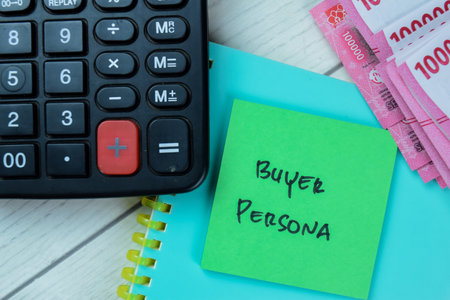 Concept of Buyer Persona write on sticky notes isolated on Wooden Table.