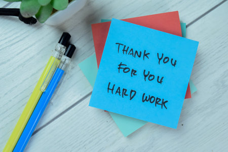 Concept of Thank You For You Hard Work write on sticky notes isolated on Wooden Table.の写真素材