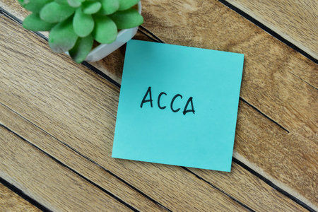 Concept of ACCA - Awareness, Comprehension, Conviction, Action write on sticky notes isolated on Wooden Table.の写真素材