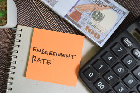 Concept of Engagement Rate write on sticky notes isolated on Wooden Table.の写真素材