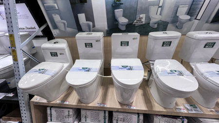 Ceramic toilet bowls of various shapes and sizes in the trading floor of a chain store. Bekasi, Indonesia, November 20, 2023のeditorial素材