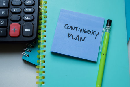 Concept of Contigency Plan write on sticky notes isolated on Wooden Table.