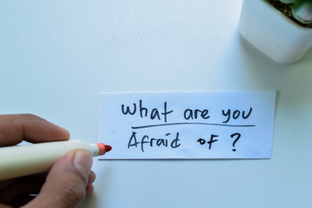 Concept of What are you Afraid of? write on sticky notes isolated on white background.の写真素材