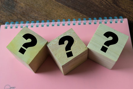 Concept of The wooden Cubes with the word ??? on white background.の写真素材