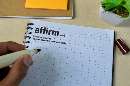 Definition of Affirm word with a meaning on a book. Dictionary conceptの写真素材