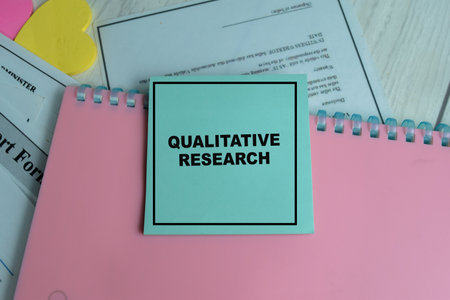 Concept of Qualitative Research write on sticky notes isolated on Wooden Table.の写真素材