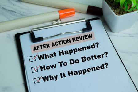 Concept of After Action Review write on paperwork. Supported by an additional services isolated on...