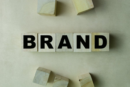 Concept of The wooden Cubes with the word Brand on wooden background.の写真素材