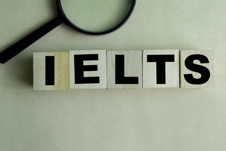Concept of The wooden Cubes with the word IELTS on wooden background.の写真素材
