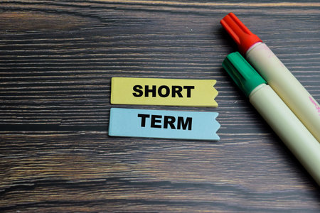 Concept of Short Term write on sticky notes isolated on Wooden Table.の写真素材