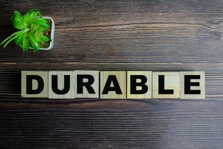 Concept of The wooden Cubes with the word Durable on wooden background.の写真素材