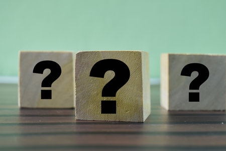 Concept of The wooden Cubes with the word Question marks on wooden background.の写真素材