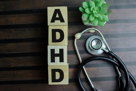 Concept of The wooden Cubes with the word ADHD on wooden background.の写真素材