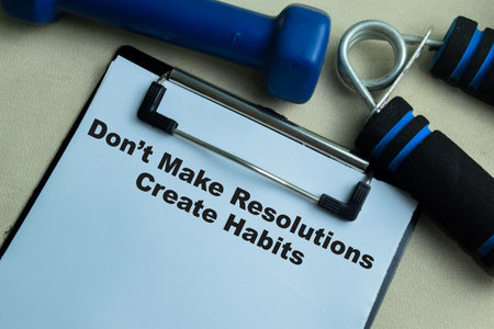 Concept of Don't Make Resolutions Create Habits write on paperwork isolated on wooden background.の写真素材