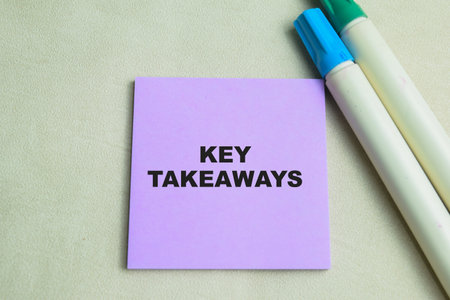 Concept of Key Takeaways write on sticky notes isolated on Wooden Table.の写真素材