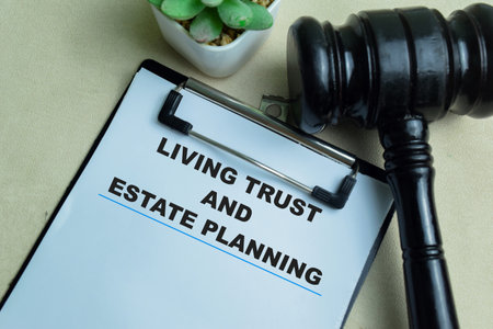 Concept of Living Trust and Estate Planning write on paperwork isolated on wooden background.の写真素材