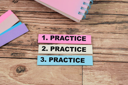Concept of Practice, Practice, Practice write on sticky notes isolated on Wooden Table.の写真素材